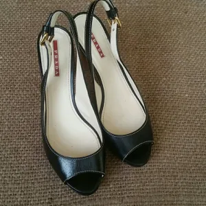 Authentic Prada open toe black leather heels