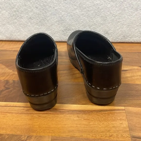 Dansko black leather clogs