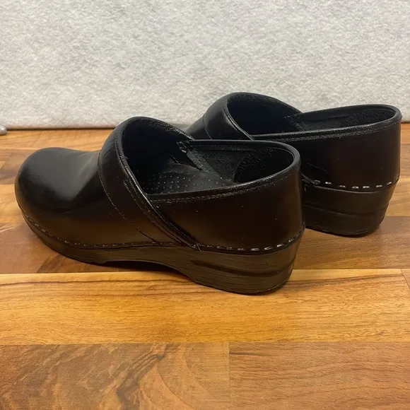 Dansko black leather clogs