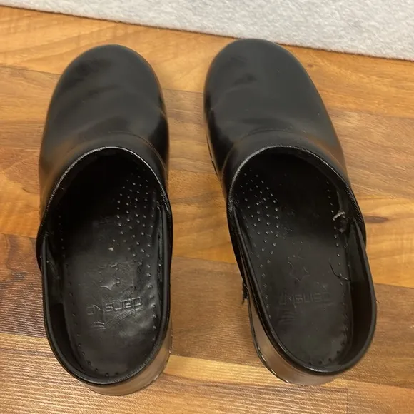 Dansko black leather clogs