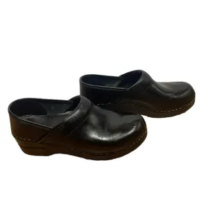 Dansko black leather clogs