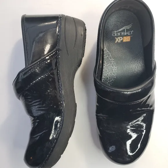 Dansko XP 2.0 black patent leather clogs
