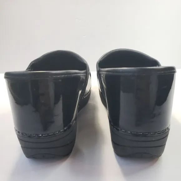 Dansko XP 2.0 black patent leather clogs
