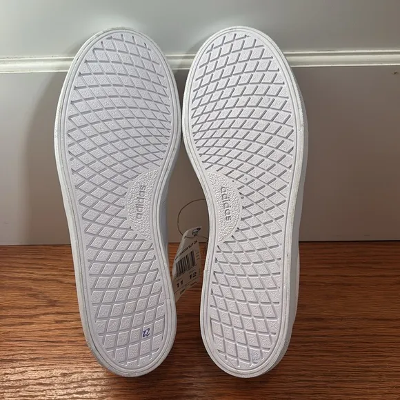 NWT unisex Adidas Vulc Raid3r slip on shoe in white canvas
